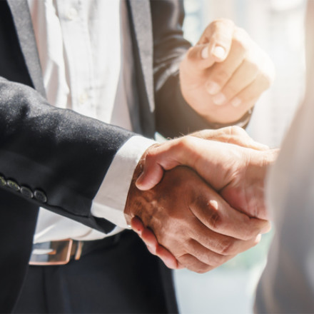close-up of people shaking hands
