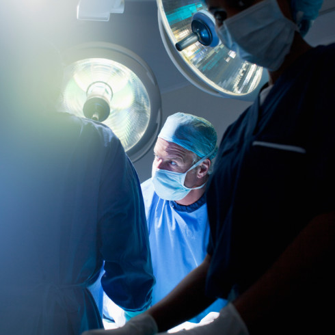 a couple of surgeons in a room