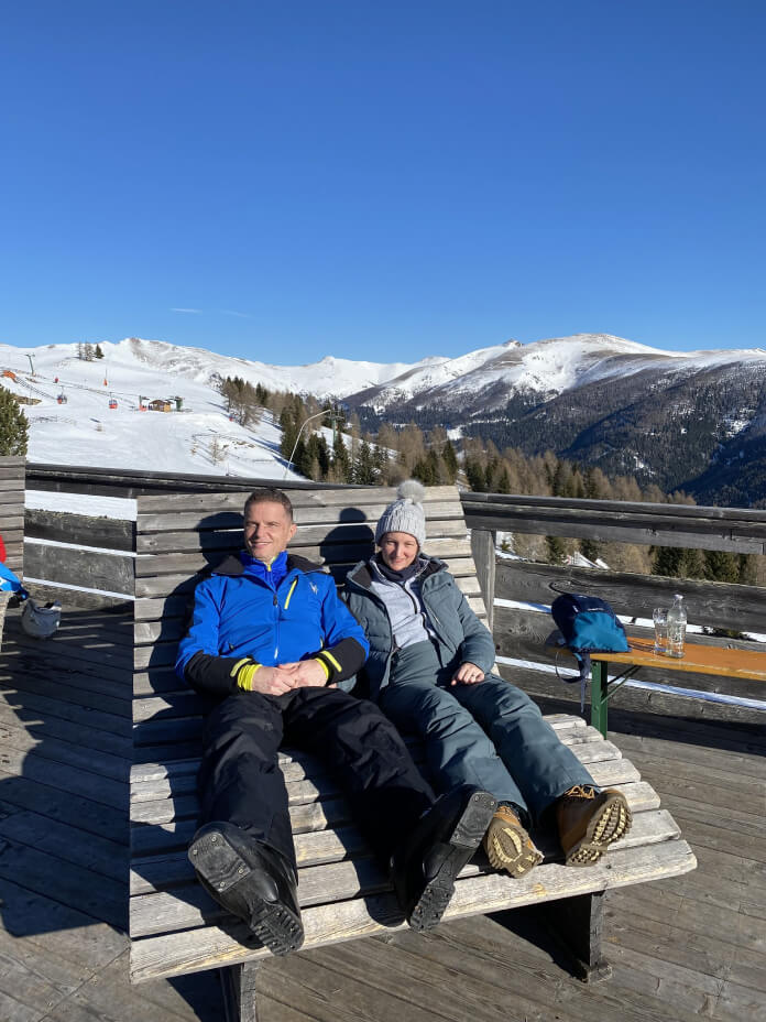 two men sitting on a bench