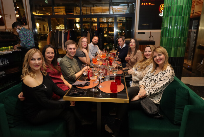 a group of people sitting at a table